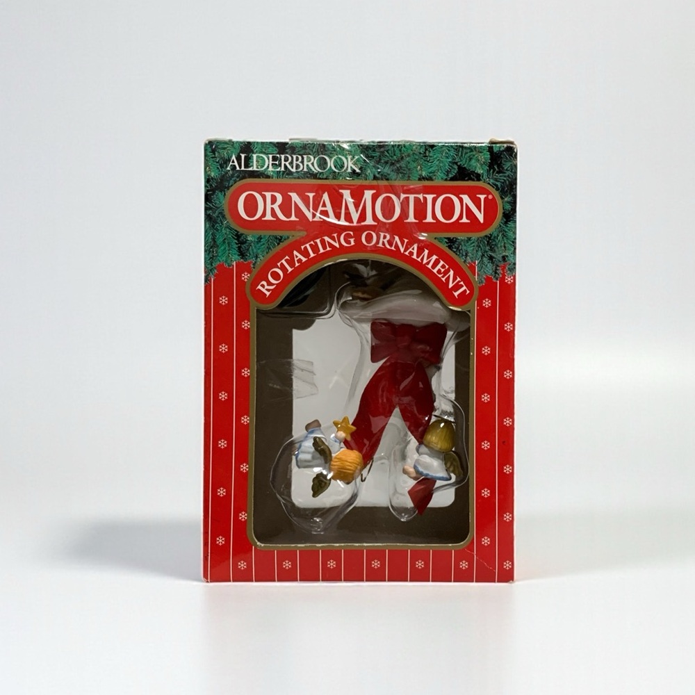 The  1989 NOMA Ornamotion Angels On Clouds Rotation Christmas Tree Ornament